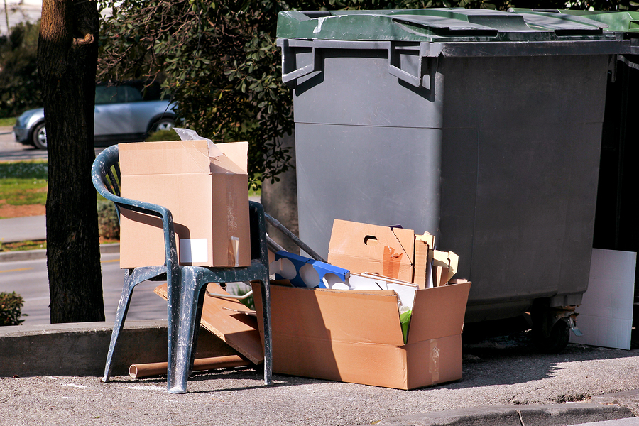 Waste Left Next To Trash Dumpster On The Street. Cardboard Boxes commercial junk